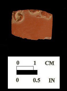 Dry-bodied red stoneware (rosso antico) hollow vessel,sprig molded decoration (front and back) from Oxon Hill site 18PR175. 