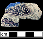 Gray-bodied salt glazed stoneware hollow (mug or jug) with applied  spiral motif.  Cobalt-blue and manganese under the glaze. Vessel probably dates to second half of 17th century, based on the applied and incised motifs with cobalt blue and manganese from 18CV60.