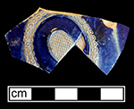 Gray-bodied salt glaze stoneware hollow (mug or jug) with applied medallion-type motif, painted in cobalt-blue under the glaze, from 18CV60.