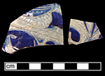 Gray-bodied salt glaze stoneware hollow (jug or mug) with engraved (incised) foliage and zigzag motif painted in cobalt-blue under the glaze, from 18CV60.