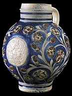 Gray-bodied salt glazed stoneware mug or jug with applied blossoms and flowers and engraved stems. Cobalt-blue and manganese under the glaze from 18CV60. Probably similar to vessel shown to the right from private collection. Vessel probably dates to second half of 17th century, based on the applied and incised motifs with cobalt blue and manganese.