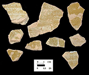 Possible Border Ware of indeterminate hollow vessel (possible jar, chamberpot or pipkin)with unglazed exterior and yellowish green lead glazed interior on a pink paste from King's Reach Site 18CV83/213C.