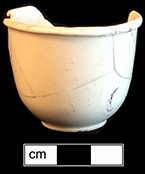 Creamware small cup. Rim diameter: 1.80” rim; Base diameter: 0.80”; Vessel height: 1.50”. Lot: 17, Provenience:1HX.603.1, Privy Stratum 4
 18BC38