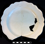 Creamware royal rim plate. Rim diameter: 7.00”. Lot: 14, Provenience: 1HA.834.6, Privy Stratum 4. - 18BC38