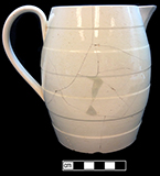 Creamware jug/pitcher, molded horizontal bands. Rim diameter: 4.00”, Base diameter: 4.00”, Vessel height: 6.25”. Lot: 47D 339-2. 18BC50.