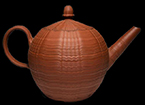 Dry-bodied red stoneware (rosso antico) teapot, engine turned decoration. Lot: 1230 and 1302. Similar teapot on right from private collection.