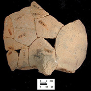 North Devon Gravel-Tempered Coarse Earthenware Pipkin. Unglazed exterior and glazed interior, 3 legged. While this site is conservatively dated c. 1660-1700, it is likely the assemblage represents the household of Henry Hosier, merchant, who occupied the site c. 1671-1686.