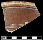 Unidentified hollow vessel, probable bowl, with rouletted decoration along rim and body.  Vessel has 11” rim diameter and a 0.25” thick body.