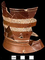 Tankard with bands of rustication and cordoning.  Capacity estimated at 1.49 pints or about 1 1/2 pints (using imperial measure), Rustication in Nottingham-type stoneware is more typical of the third quarter of the eighteenth century. 
