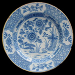 c. 1740 British plate with yellow rim showing Broad panels or medallions painted with designs. Peak of popularity 1720s-1730s - Private collection.