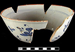 Reconstructed bowl with Chinoiserie design, painted in blue with Chinese style landscape and figure, and red rim line. Chinese landscapes on tin glaze most predominant 1720s-c 1780, with peak production circa 1750. Red rim lines date between 1730s to 1790s with highest occurrence in 1730s and 1740s.