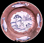 Whole plate shown on right with fish motifs, Private Collection