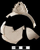 White salt glaze stoneware porringer with shell-molded handle. Rim diameter:  4.33”; Base diameter:  2.75”; Object ID: 2565. Learn more about this object at: http://mountvernonmidden.org/default.html.