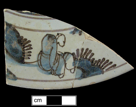 Plate painted in blue and purple with seated Chinese figure.  Dated examples with seated figures date 1669-1737 (Shlasko 1989).