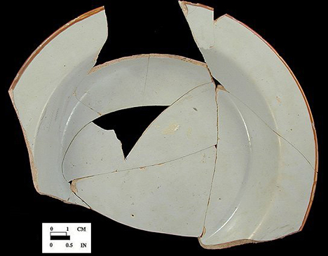 Edge painted plate - rim lines appear on dated vessels between 1730s to 1790s, with highest occurrence in 1730s and 1740s (Shlasko 1989). Rim line is usually a reddish or brown color and is believed to have been done in imitation of Chinese porcelain. 