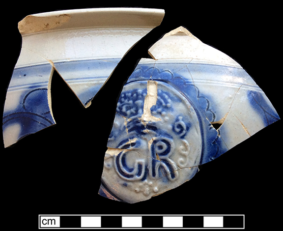 Debased scratch blue bowl with cross-hatched motif, both sherds appear to be from the same vessel, Lots 118.031 and 118.032 from 18WA20.