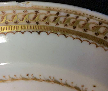 Chinese hard paste porcelain plate overglaze painted in brownish red and gold gilt.  This feature contained a large number of vessels in this patter and also contained an armorial seal with the initials of -----. Rim diameter:  8.0” - from 18BC33.