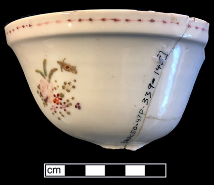 Chinese porcelain bowl, painted overglaze in famille rose palette with floral and neoclassical motifs. Madsen and White (2011:106-107) place the dating of famille rose as c. 1720-1800.  Floral spray motifs in famille rose were popular from the 1740s through the 1760s. Rim diameter: 4.00”. Lot: 47D 339-145. 18BC50.