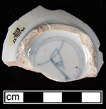 Common shape cup painted underglaze in blue. Unidentified mark on base of cup, possible artemesia leaf. Minimum Vessel 6651 (Lot 3115). Note: Cellar filled in mid-19th century with soil removed from yard of 18th-century house during landscaping.