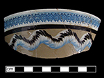 Common cable on bowl with blue rouletted double circle pattern around the rim-from 18BC27.