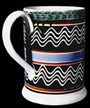 Pearlware quart mug with trailed slip decoration. Attributed to Enoch Wood & Sons, Staffordshire, c. 1830. 6 inches in height - from a private collection.