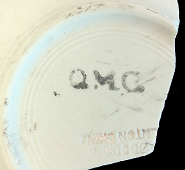 Saucer. Unglazed bisque waster. Rim diameter: 6.5”; 6.2 mm thick. Printed “QMC” mark, abbreviation for Quarter Masters Corps (1912-1923) (Hunter Research Poster)