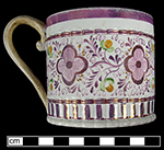 Painted handled mug with pink luster in floral motif.  Note that the handle is a complete reconstruction, done with two metal wires that have been drilled into the body of the mug at the handle base - from a private collection.