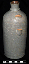 Buff bodied jug with grey salt glaze. One pint capacity. The straight sides and definite shoulder on this vessel suggest that it was made after circa 1850. Vessel height: 8.00”, Vessel body diameter: 3.00”, Vessel V-7 from 18MO609.