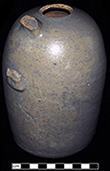 Grey bodied salt glaze stoneware jug. 1 quart capacity. The full bellied/ovoid form of this jug was more common in the first half of the nineteenth century (Greer 1981). Vessel height: >7.00”, Vessel body diameter: 4.50”, Vessel V-6 from 18MO609.