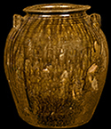 North Carolina alkaline-glazed stoneware five-gallon jar, late 19th century.  This vessel displays the drips and runs that can characterize some alkaline glazes. Vessel height:  14.25“.