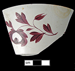 Painted London shape cup with floral motif in chrome red.