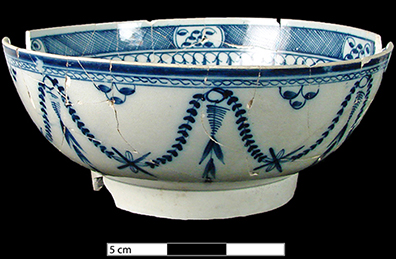 Blue painted jug in a chinoiserie style (Chinese house pattern) typical of china glaze and early pearlware.