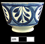 Pearlware painted underglaze London shape cup and matching saucer with leaf motif. Impressed hand mark on reverse of saucer has been associated with the firm of John and Richard Riley , in operation in Burslem from 1802-1828 (Pomfret 2005). 3.75” cup rim diameter;  2.5” cup height.