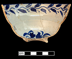 Pearlware painted underglaze Canova shape cup with floral motif.  3.75” rim diameter; 2.5” vessel height. Image on right shows cup interior.