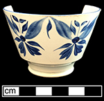 Pearlware painted underglaze London shape cup and matching saucer with floral motif.  This vessel is one of four matching cups and saucers from this privy.  Each of the three cups contains the same x-shaped workman’s mark.  3.5” cup rim diameter; 6.0”saucer rim diameter; 2.5” cup height.