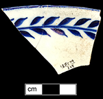 Pearlware painted underglaze common shape bowl with floral motif. To right is a photograph of interior rim of bowl. 7.0“ rim diameter.
