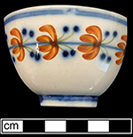Pearlware painted underglaze  common shape cup.  2.75" rim diameter; 1.75" vessel height.  18BC79