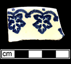 Cut sponge saucer with blue leaf motif. Rim diameter:  6.50”