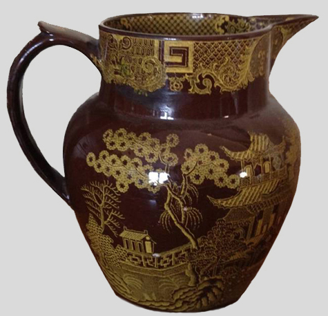 This jug is decorated with a Chinoserie-style motif.  The interior of the jug is coated with a white slip - private collection.