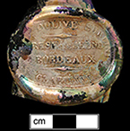 Olive oil bottle seal molded DOLIVE SURFIN and CLAIRIE III in a semi-circle around the edge of the seal.  GRESE LE JEUNE BORDEAUX in the center of the seal between two horizontal lines intersected with diamonds, from 18BC27.