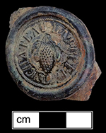 Wine bottle seal molded with a bunch of grapes encircled by the words “Chateau Lafitte”. 35 mm diameter- from 18BC33.