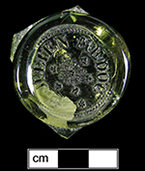 Wine bottle seal molded St. JULIEN MEDOC around an ornament of grape clusters and vines, from 18BC51.