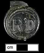 Wine bottle seal molded with initials RD enclosed within a circle, 31 mm diameter, from 18PR705.