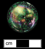 Private collection - Machine made glass marble. Dappled or mottled surface glass marbles began production around 1983 (Randall and Webb 1988:41), Donated to MAC Lab from private collection - click image to see larger view.