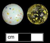 Private collection - Machine made glass marble. Spotted or dotted surface glass marbles began production around 1983 (Randall and Webb 1988:41), Donated to MAC Lab from private collection - click image to see larger view.