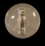 Photo of similar sulphide marble with an owl figurine from a private collection shown to the right of the18BC80 sulphite marble - click on image to see larger view.