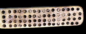 Bone handled toothbrush with gradual neck. Some of the bristles are still present in the stock. 175 mm length. Slightly convex cranking, wire drawn bristle attachment, handle has a square base with oval cross section. 1D.859.1 - 18BC38