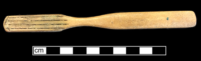 Bone handled toothbrush with gradual neck. Rounded square stock, handle has flat oval cross section; rounded base, with wire drawn bristle attachment. 1G.448.12 18BC38