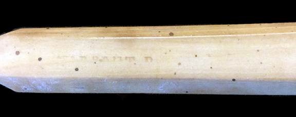Bone handled toothbrush stamped “Warranted” on the reverse. Elongated hexagonal handle. Privy 5, filled between 1829-1837. 18BC79