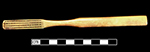 Bone handled toothbrush with gradual neck. Some of the bristles are still present in the stock. 175 mm length. Slightly convex cranking, wire drawn bristle attachment, handle has a square base with oval cross section. 1D.859.1 - 18BC38